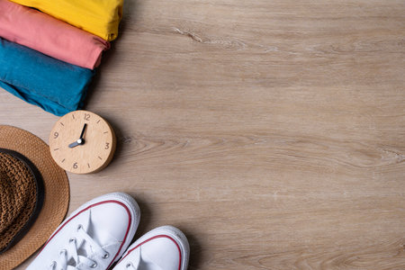 Flat lay concept of travel accessories vacation trip and long summer weekend planning on wooden table with blank space for text background.の写真素材