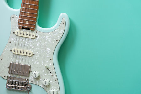 Electric guitar on green table background, close up music conceptの写真素材