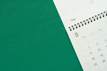 close up of calendar on the green table background, planning for business meeting or travel planning conceptの写真素材