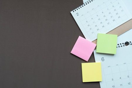 close up of calendar on the brown table background, planning for business meeting or travel planning conceptの写真素材