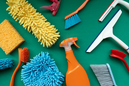 House cleaning plastic product on green table background, home service or housekeeping conceptの写真素材