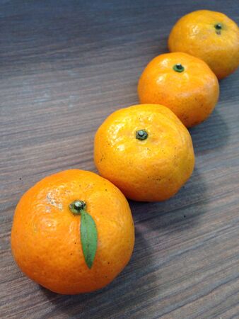 Four oranges set in a rowの素材