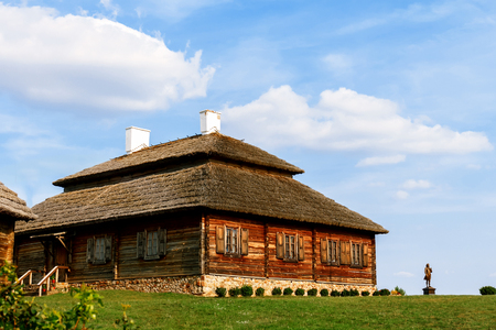 Wooden ethnic houses on rural landscape - village of birthplace of Tadeusz Kosciuszko - Kossovo, Belarus.の写真素材