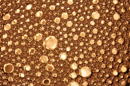 Bubbles in water on gold background horizontal pattern. Circle and liquid, light design