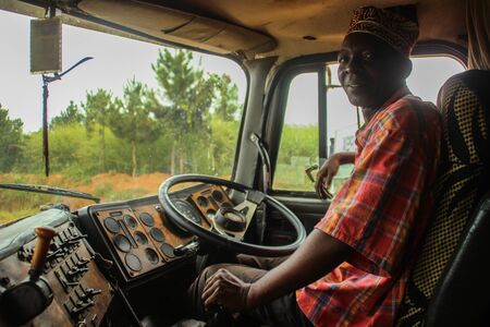 Lusaka, Zambia - March 23, 2015: Elderly black African driver driving old truck