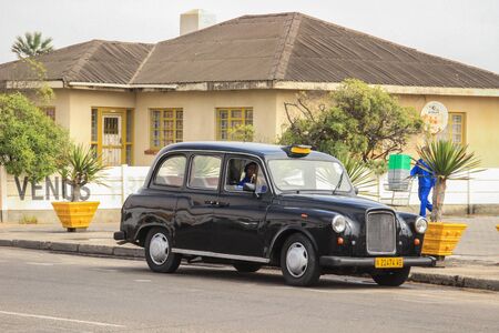 Walvis Bay, Namibia - April 25, 2015: Old vintage car on Walvis Bay street.のeditorial素材