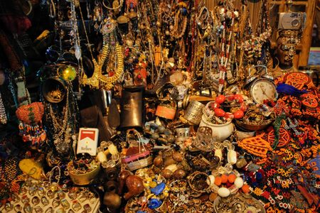 Istanbul, Turkey - May 15, 2017: randomly scattered bracelets, beads, earrings and rings made of precious metals and stones on the Istanbul marketの写真素材