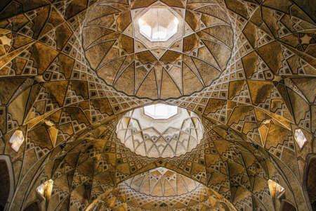 Qom, Iran - 2017: Details of the decorations of the magnificent Iranian (Persian) Mosque Fatima Masumeh Shrine in gold colourのeditorial素材