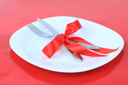 Romantic Dinner on red background. Place setting for Valentineの写真素材