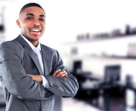 Portrait of a handsome successful business man busy working in his officeの写真素材