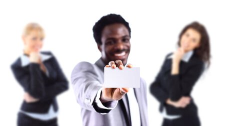 Young African American businessman holding a white business card の写真素材