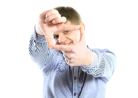 Focus on executive making frame with his hands on white backgroundの写真素材