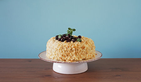 Homemade Layer Blackcurrant Jam Cake on the plate on blue background, copy spaceの写真素材