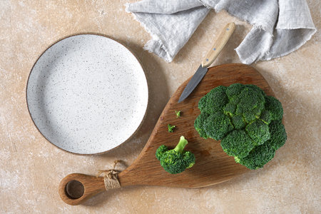 Broccoli. Fresh green broccoli on a cutting desk on table. Top view. Free copy space.の写真素材