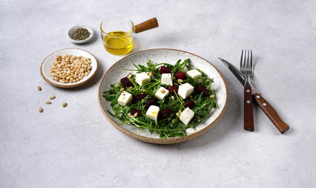 Salad of arugula and beets, pine nuts and with cheese. Vegetarian ideas fo cooking foodの写真素材