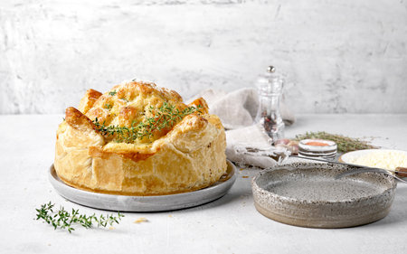 Baked cauliflower baked in puff pastry wit cheese. Delicious dish. Perfect tasty snack, copy spaceの写真素材