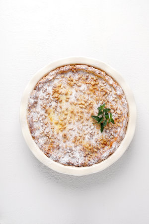 italian tart - torta della Nona with ricotta and custard, pine nuts, top vertical view