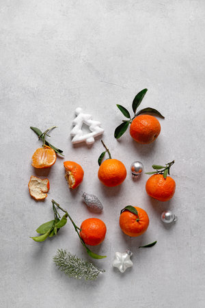 Christmas composition with tangerines, fir branches, christmas toys. Flat lay, top viewの写真素材