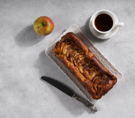 Apple Gateau Invisible and a cup of coffee on the table in hard light. top view, copy spaceの写真素材