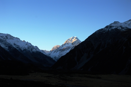 Mount Cook lit up by the setting sun,viewed from Mount Cook Village,New Zealandの写真素材