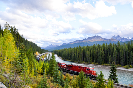 Freight train running in Canadian Rockies in Autumn, Canadian Rockiesのeditorial素材