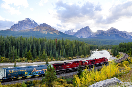 Freight train running in Canadian Rockies in Autumn, Canadian Rockiesのeditorial素材