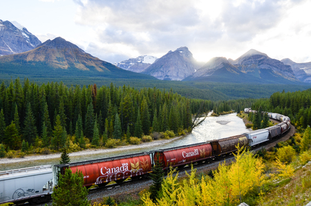 Freight train running in Canadian Rockies in Autumn, Canadian Rockiesのeditorial素材