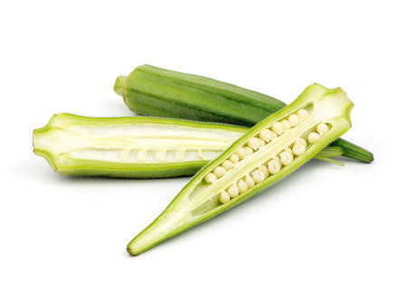 Okra cut in half isolated on white backgroundの写真素材