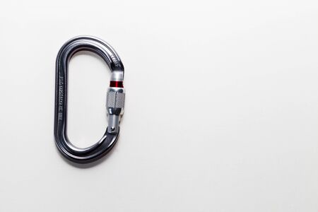 Carabiner for mountaineering, rock climbing and caving on a white background.の写真素材