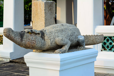 Crocodile statue in Wat Arun ancient craftsmanship の写真素材