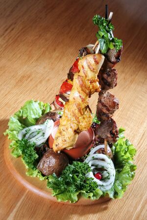 Meat and vegetable grilled on small skewerの写真素材