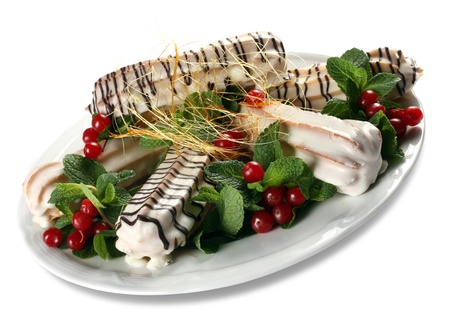 Cake eclair with mint and berry