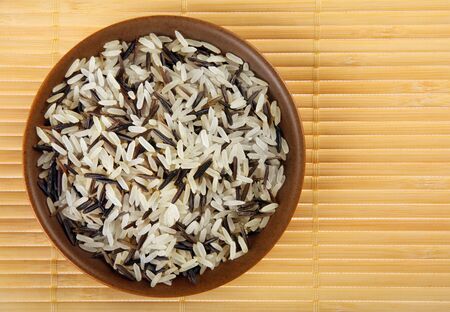 Rice wild white detail view with brown plate の写真素材