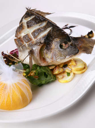 Fried fish with lemon and mushroom vegetable