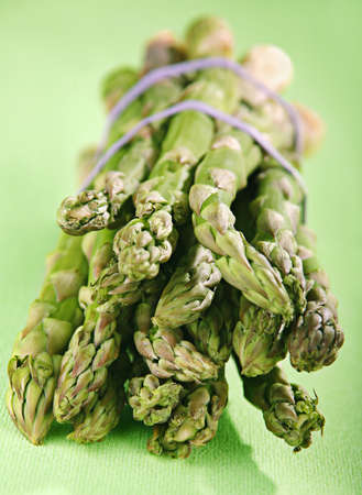 Vegetable asparagus bunch on green backgroundの写真素材