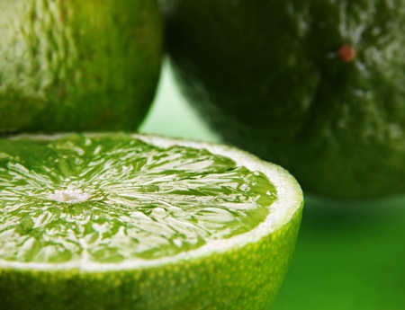 Citrus fruit green lime with slice closeupの写真素材