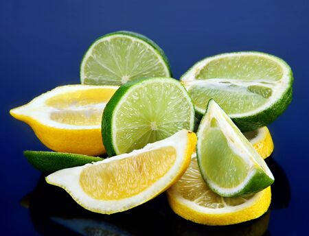 Citrus fruit green lime and lemon with sliceの写真素材
