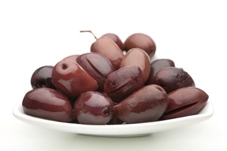 Brown olive vegetable closeup on white backgroundの写真素材