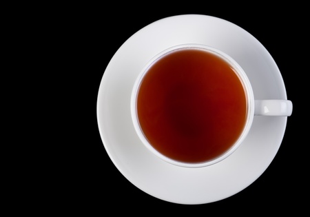 Tea drink in white cup on dark backgroundの写真素材