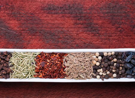 Spice mix closeup view on brown board