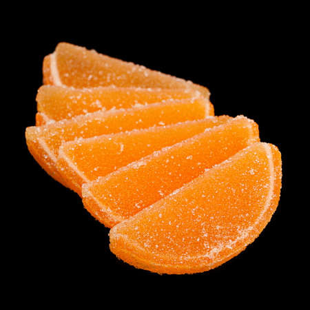 Marmalade as orange clice isolated on black backgroundの写真素材