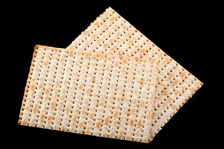 Matzo traditional jewish bread isolated on black