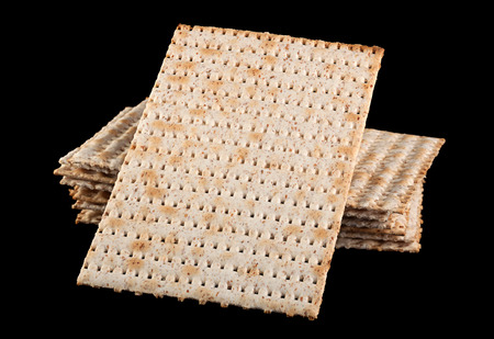 Matzo traditional jewish bread isolated on black