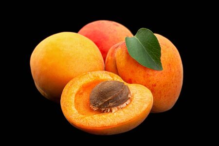 Apricot fruit closeup isolated on black backgroundの写真素材