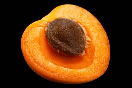 Apricot fruit closeup isolated on black backgroundの写真素材