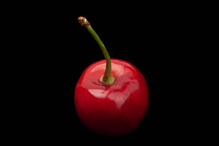 Cherry fruit closeup isolated on black backgroundの写真素材