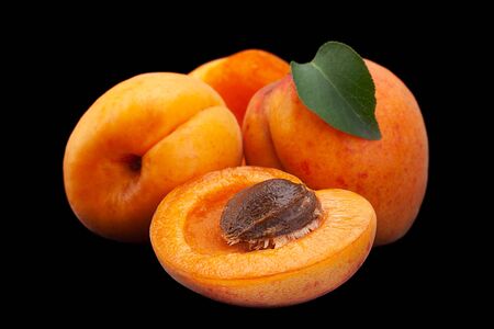 Apricot fruit closeup isolated on black backgroundの写真素材
