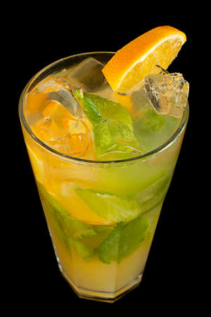 Cocktail with slice orange and mint on blackの写真素材