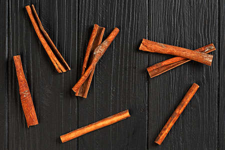 Cinnamon spice stick on black table closeupの写真素材