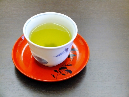 Green tea from Japan in a cup, decorative plate.の写真素材